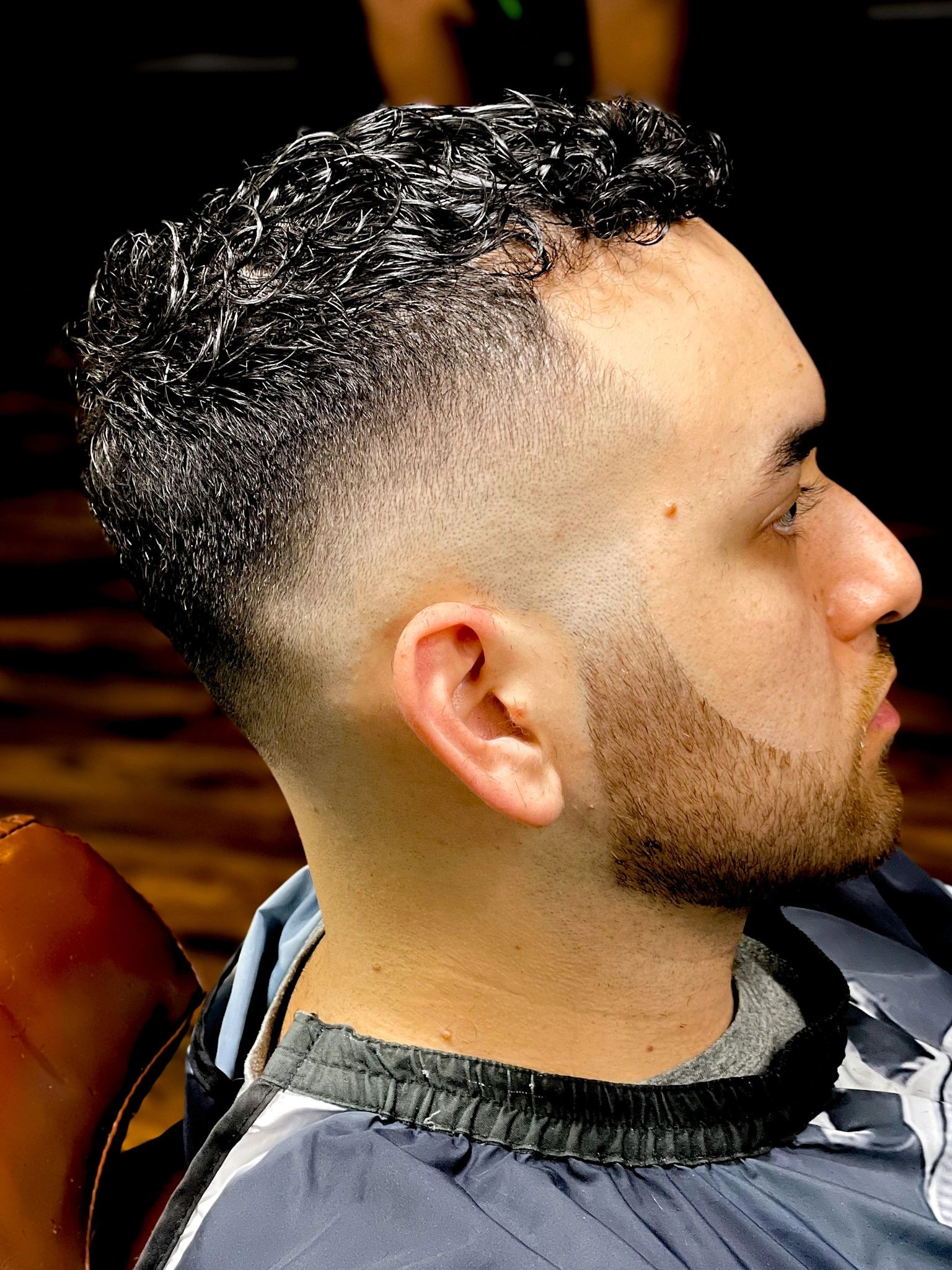 Curly top fade with beard